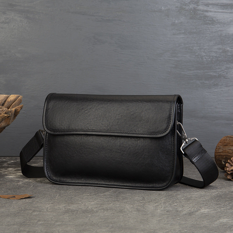 Business Vegetable Tanned Leather Crossbody Bag gray angled view